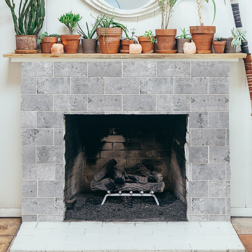 peel and stick stone backsplash used on the fireplace